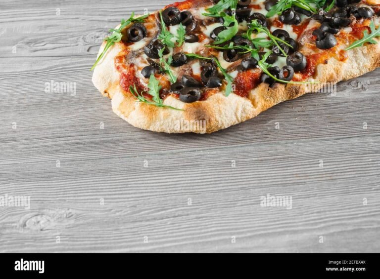 Dove trovare la pinsa no stop a Roma per un'esperienza unica 32 pinsa romana su un tavolo di legno